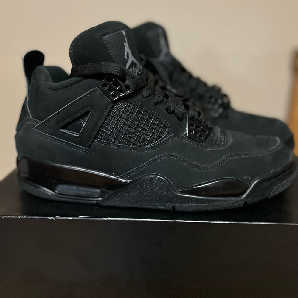 Air Jordan 4 Retro 9.5. Light creasing on left shoe. Used once. Great condition